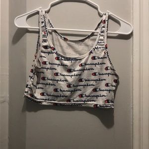 white with the logo Champion crop top
